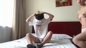A Pair Of Chinese Lovers Sharing A Hotel Suite